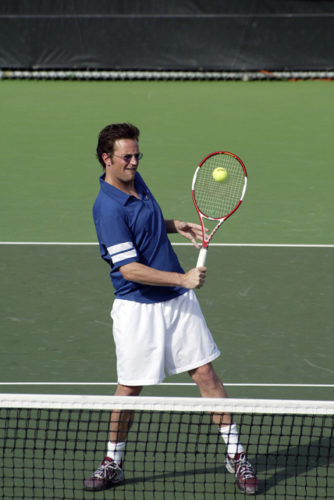 Matthew Perry playing tennis